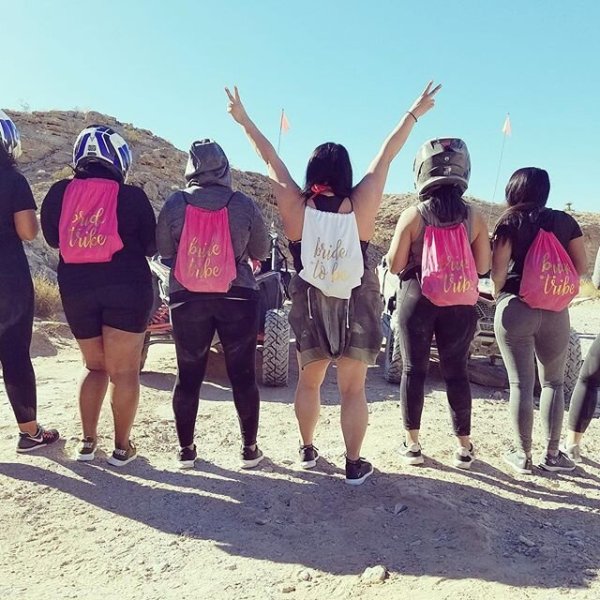 a bridal party ready to drive some Can-Am vehicles