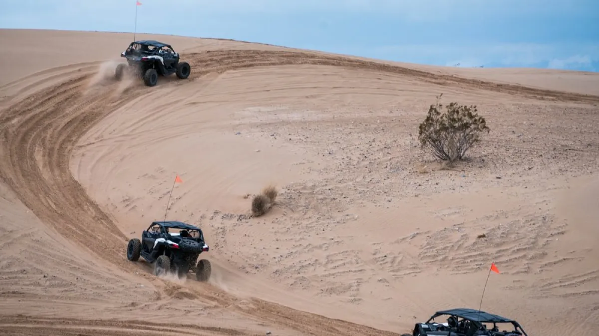 Can-Am Maverick X3s riding over a desert trail