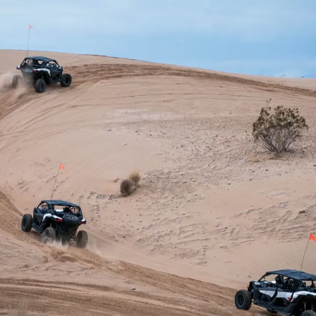 Can-Am Maverick X3s riding over a desert trail