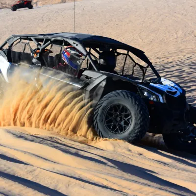Can-Am Maverick X3s speeding across the sand